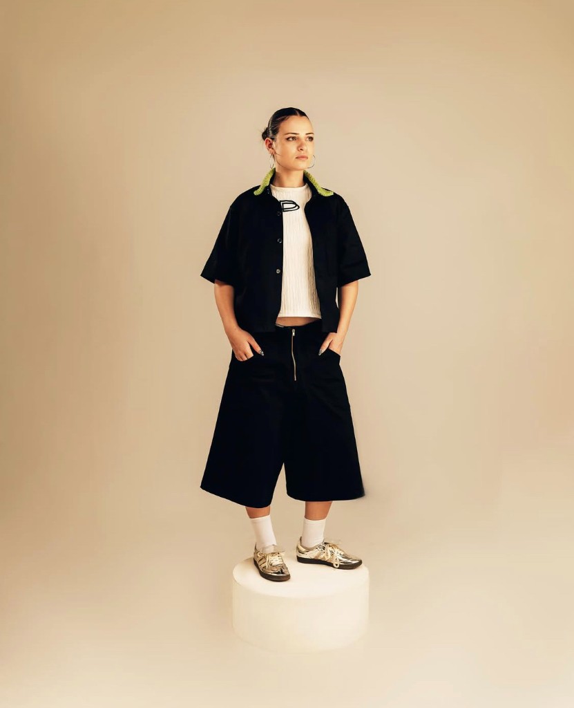 DARKOS look with lime green collar detail, studio portrait